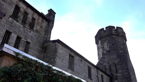 medieval style building with tower and parapet