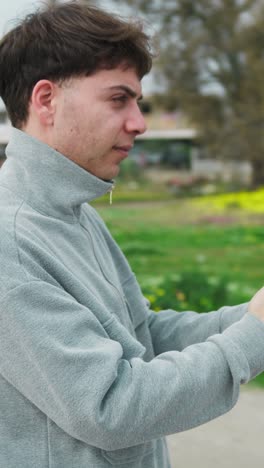 Man Showing Flowers To His Loved One While Having A Videocall Outdoor
