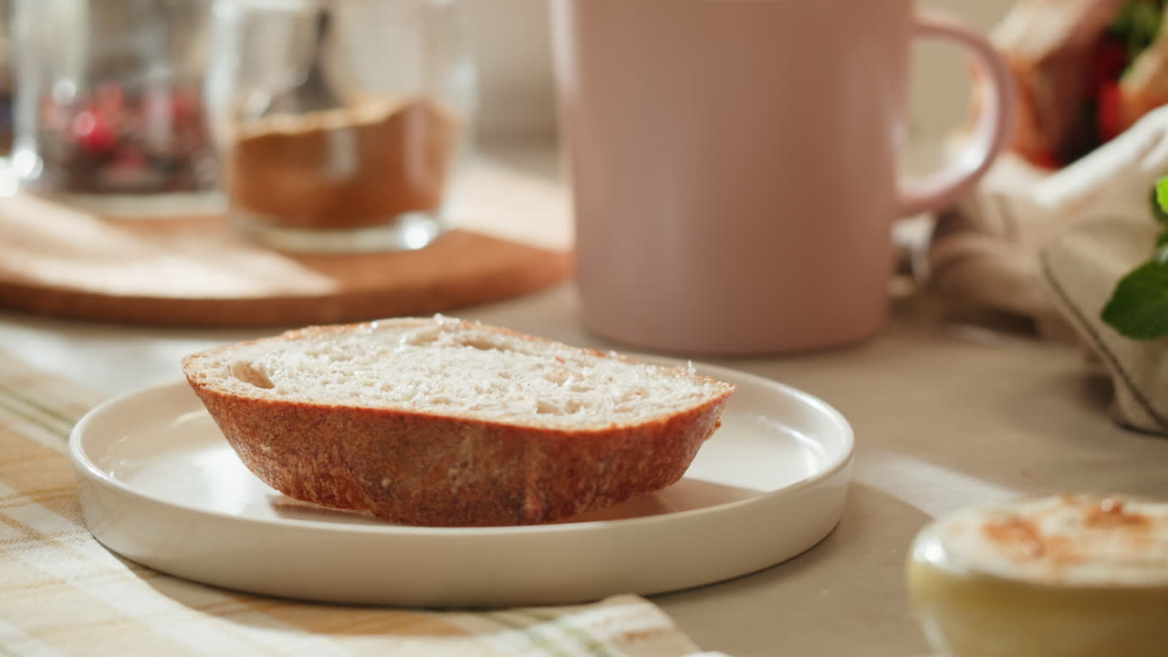 Woman Spreading Butter on Bread