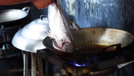 sequential steps of frying a fish in a pan