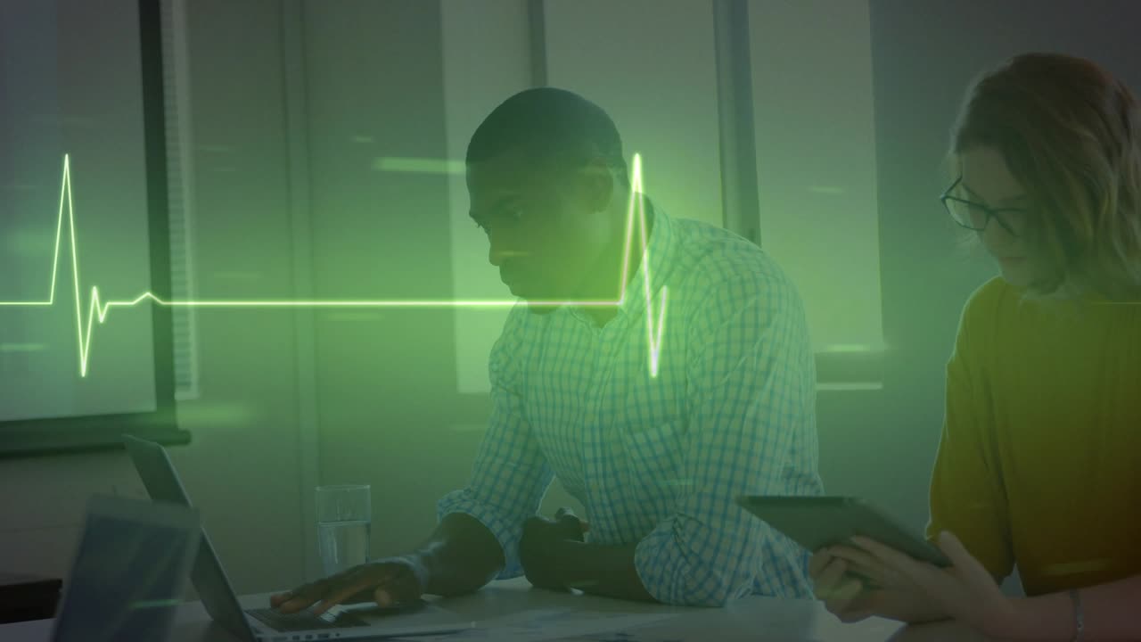 Animation of cardiograph over diverse business people using laptop
