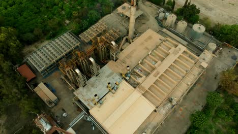 aerial top shot of a cement factory in pakistan durng evening.