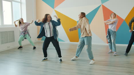 group of young women dancing in a dance studio