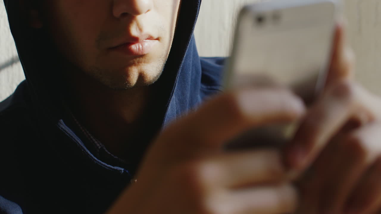 Very Tired Man Writes A Message On The Phone He's In The Hood His Eyes Sleepy Stick