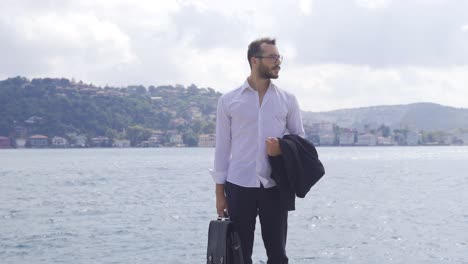 Businessman-waiting-by-the-sea-in-the-Bosphorus.