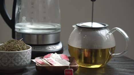 beautiful shot of pressing down tea kettle of cerasee kerala bitter melon plant with kerala hanging from vines used to make herbal healthy tea good for weight loss