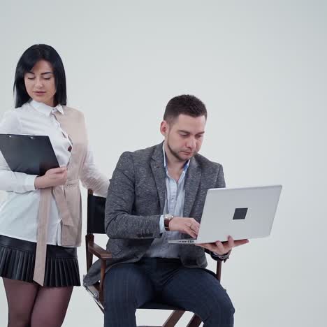 . successful business couple in studio. business couple isolated on grey background