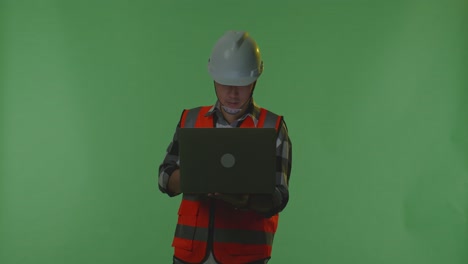 construction worker using laptop