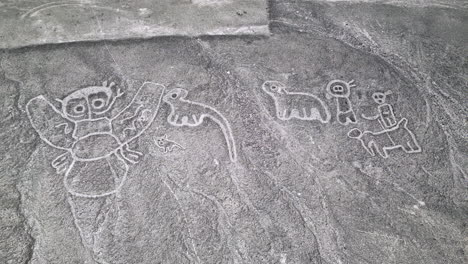 aerial view of the mysterious humanoid creatures in nazca desert, peru