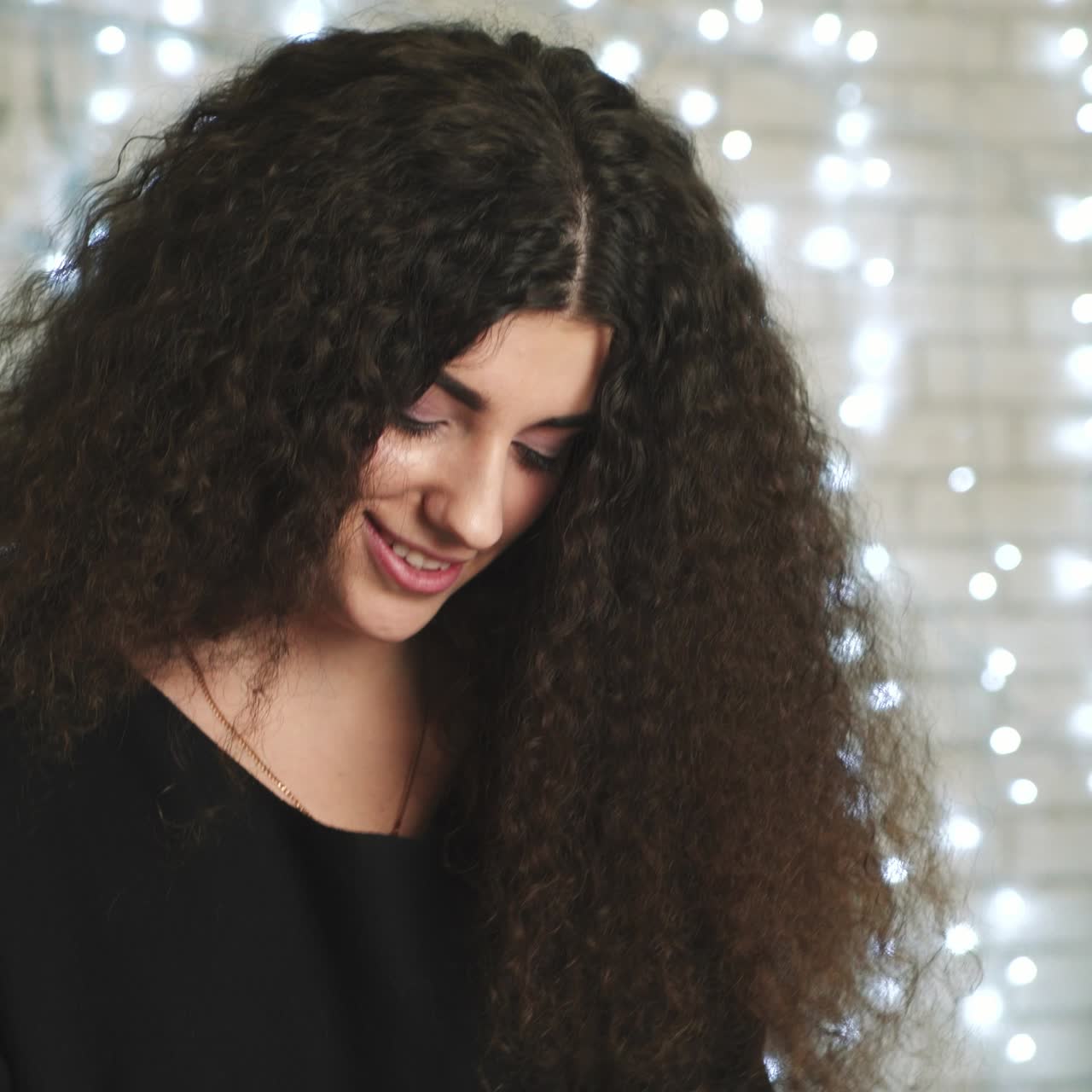 Woman with gifts on bed
