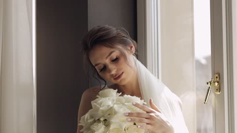 beautiful bride with white bouquet