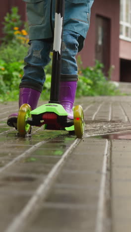 kid scooter cuts through rain-soaked air. child on scooter embraces spontaneity of moment finding beauty and wonder in simplicity of rainy day ride