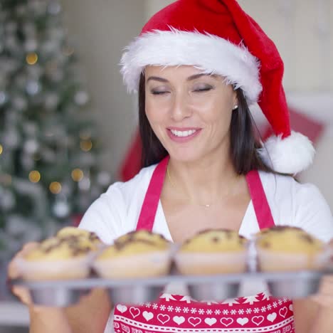 charming young woman with fresh baked cookies