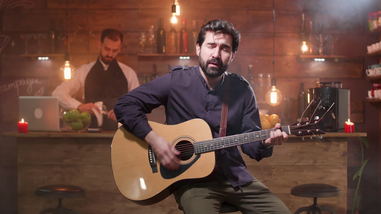 Musician Playing Guitar at a Bar