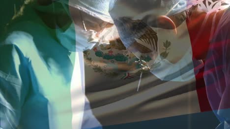 animation of flag of mexico waving over surgeons in operating theatre