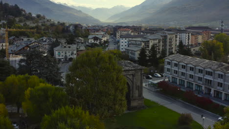 A-mesmerizing-view-of-the-Valle-d’Aosta,-with-the-amazing-Arch-of-Augustus,-a-monument-in-the-city-of-Aosta,-northern-Italy,-A-Drone-view