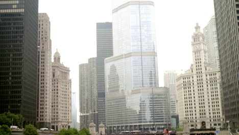 Happy-smiling-woman-standing-on-bridge-over-the-river-in-big-city