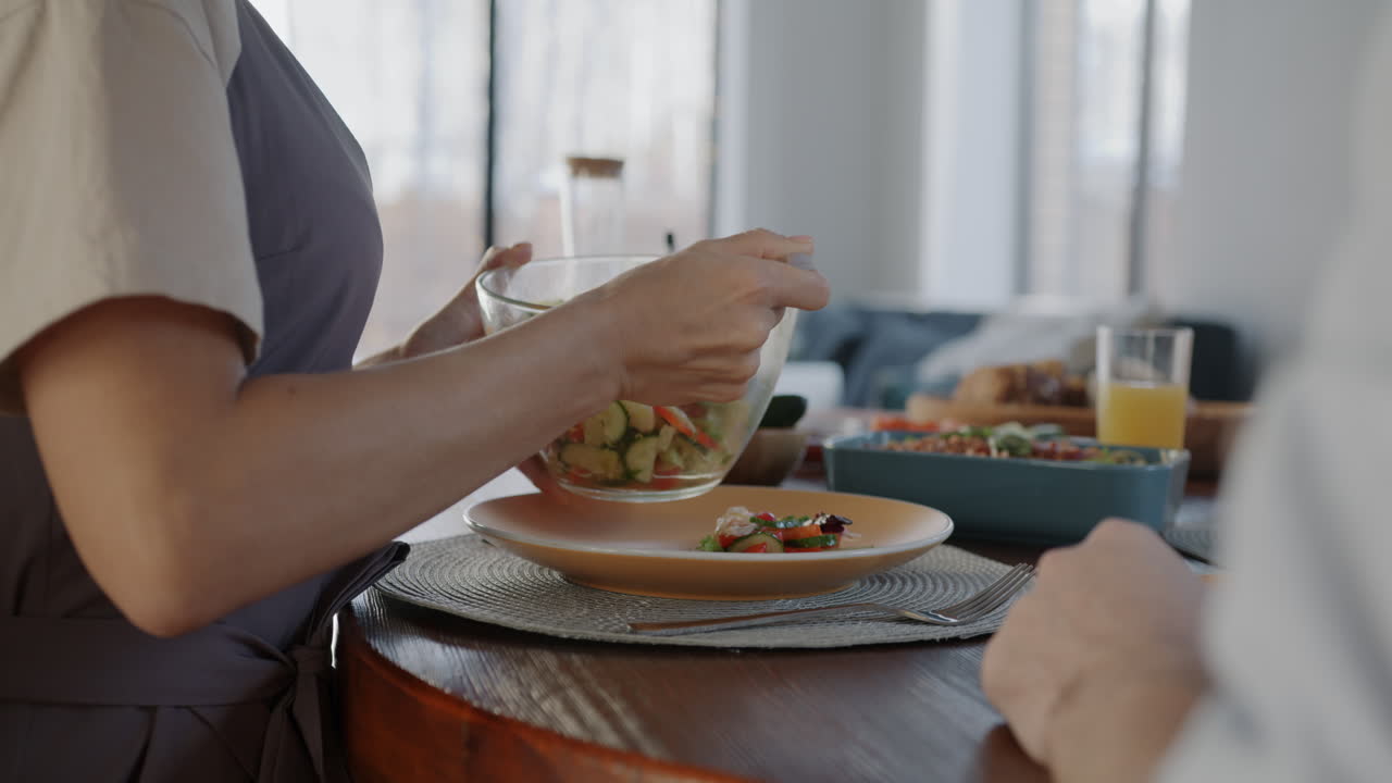 Couple sharing a healthy salad dinner