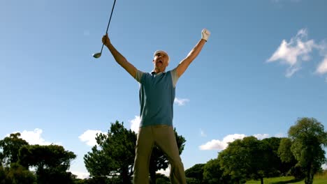 ecstatic golfer jumping up and cheering