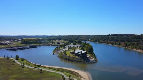 drone shot flying over a american flag towards a freedom point at clarksville marina