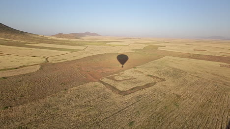 A-shadow-of-a-hot-air-balloon-with-a-view-on-the-countryside