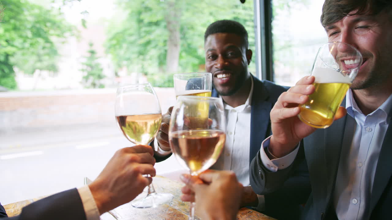 Point Of View Shot Of Businessmen Making Toast In Bar Together
