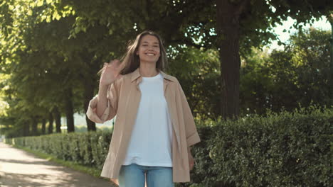 woman walking jumping in summer park