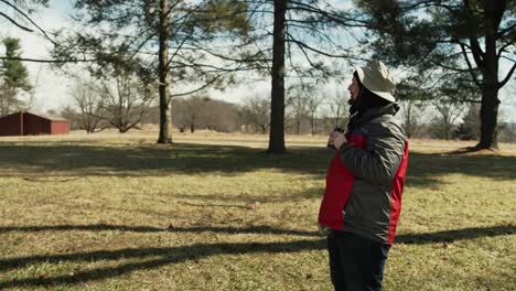 Man-out-in-nature-taking-photographs-and-looking-with-his-binoculars