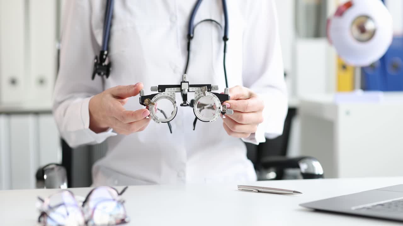 Optometrist holding a trial frame