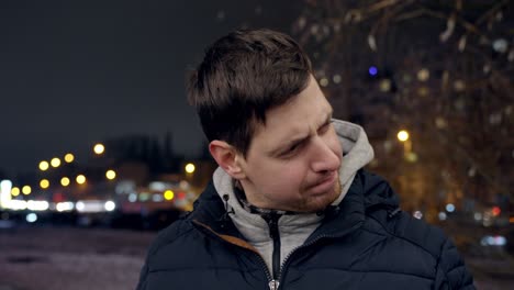 unsatisfied young male cursing in closeup with text space on left side