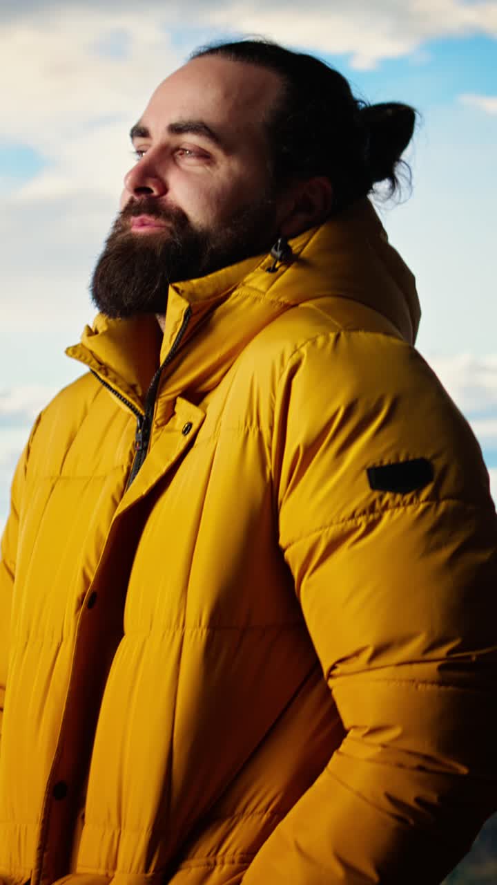 Bearded Man in Yellow Jacket Enjoying Mountain View