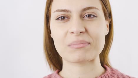 woman eating salted nuts in close-up. nuts.