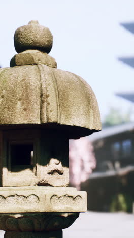 a stone lantern in a japanese garden