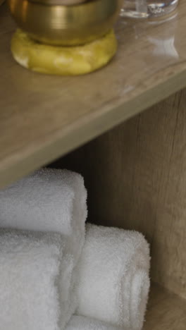 stack of white towels on a shelf