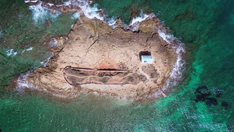 Aerial-View-Of-A-Cute-Little-Island-With-A-Little-Chapel