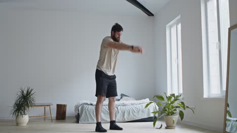 man stretching and exercising at home