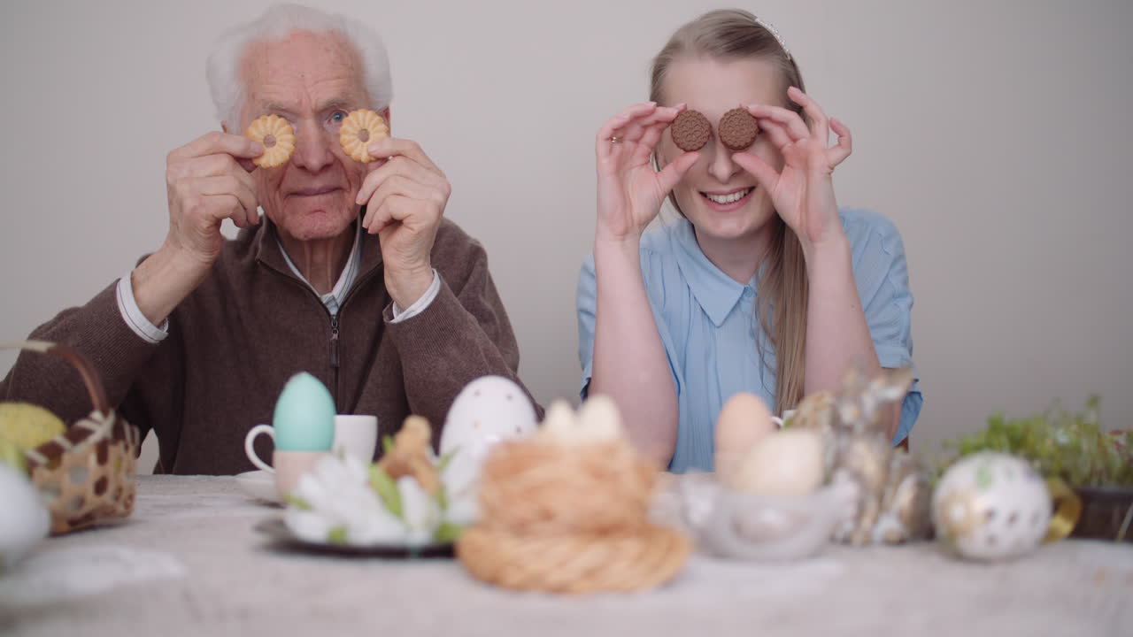 Senior Man Smiling Chererful Grandfather And Granddaughter Playing With Cakes And Smile 