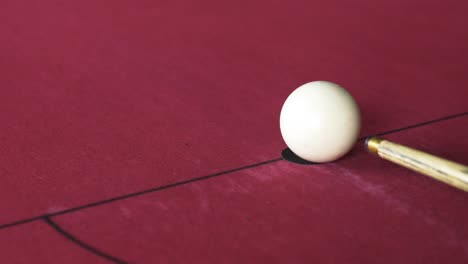 white ball being hit at the beginning of a pool game