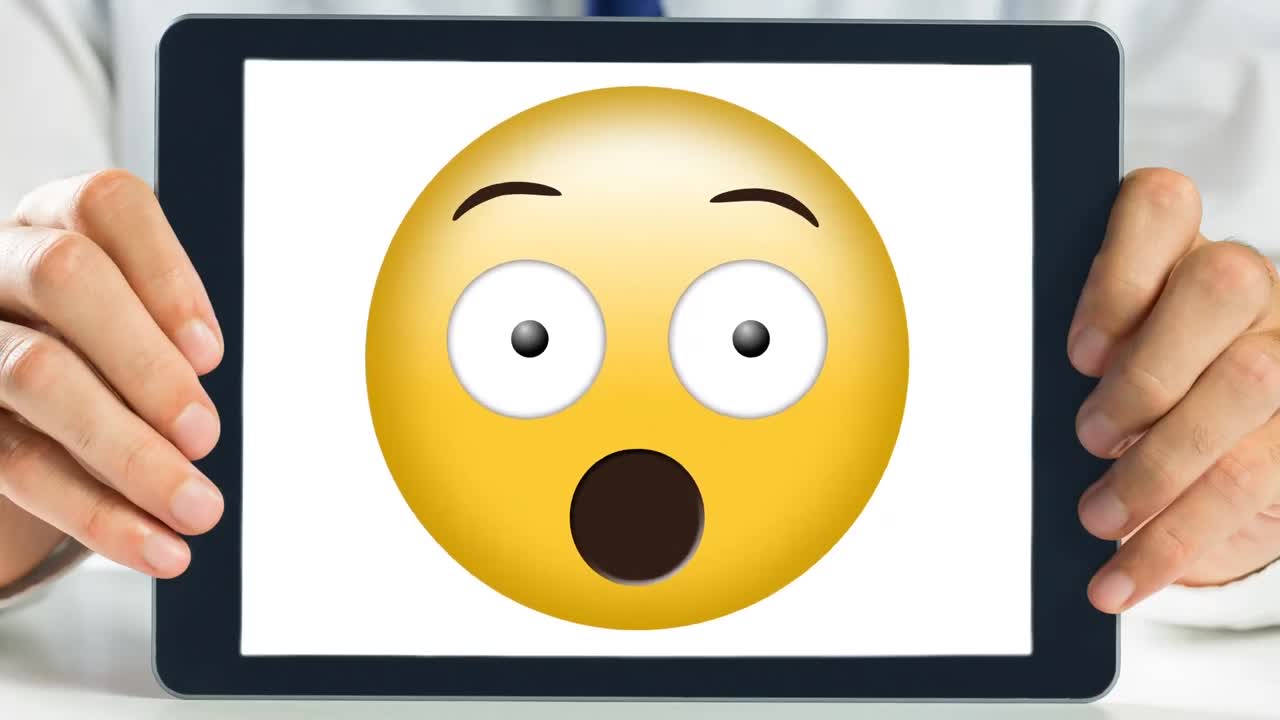 Tablet showing shocked animated smiley video