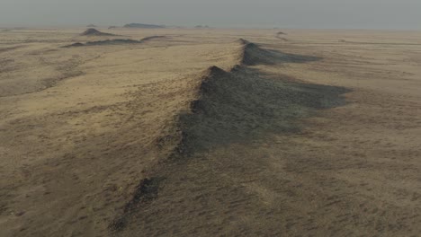 mountain ridges in namib desert plains in africa, aerial landscape