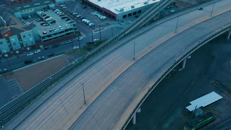 Bicyclist-and-car-meet-on-a-deserted-road-during-Covid-19-pandemic-locking-during-stay-at-home-orders