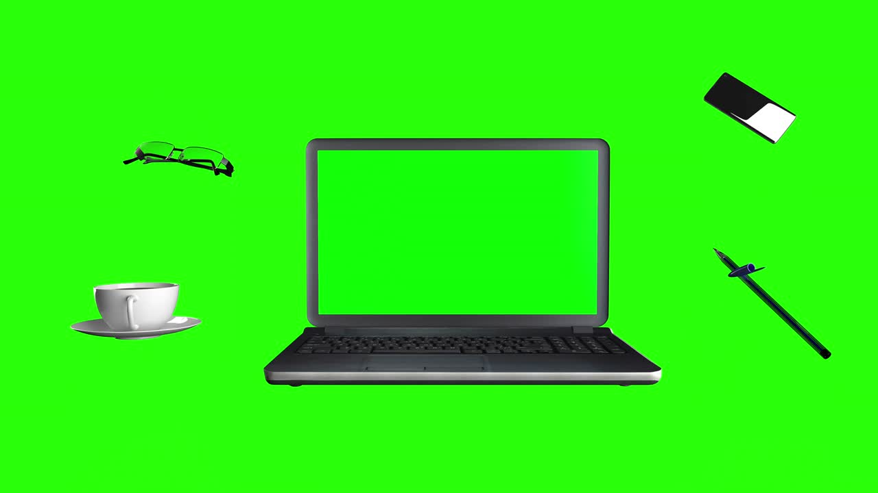 portátil, gafas, café y bolígrafo. concepto de lugar de trabajo en una pantalla verde.