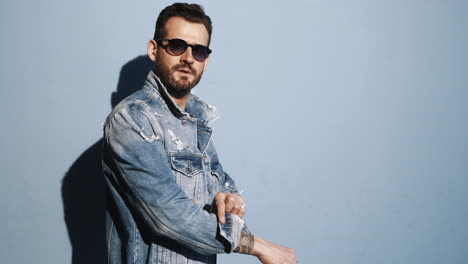 man in denim jacket and sunglasses