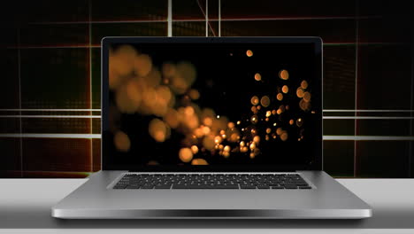 pantalla de portátil que muestra luces bokeh doradas 4k