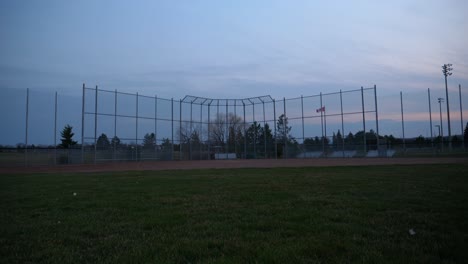 empty baseball field at dusk