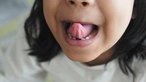 child with tongue out