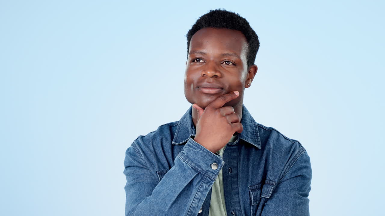 Black man, happy and thinking of ideas in studio