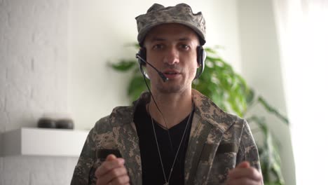 portrait of a man in military fatigues, face to camera