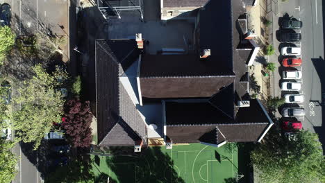 aerial perspective looking down onto old school with constructions works actively renovating the site