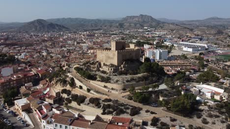 Aerial overview of the towns of Elda and Petrer, Spain, ending at the Moors castle